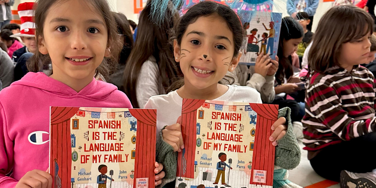 Students in RGV pose with Michael Genhart's bilingual book, Spanish is the Language of my Family