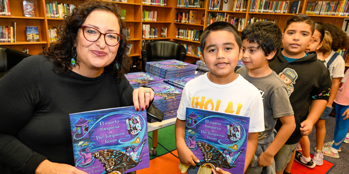 Author Monica Brown sharing her book, The Turqouise Room/El Cuarto Turquesa with students